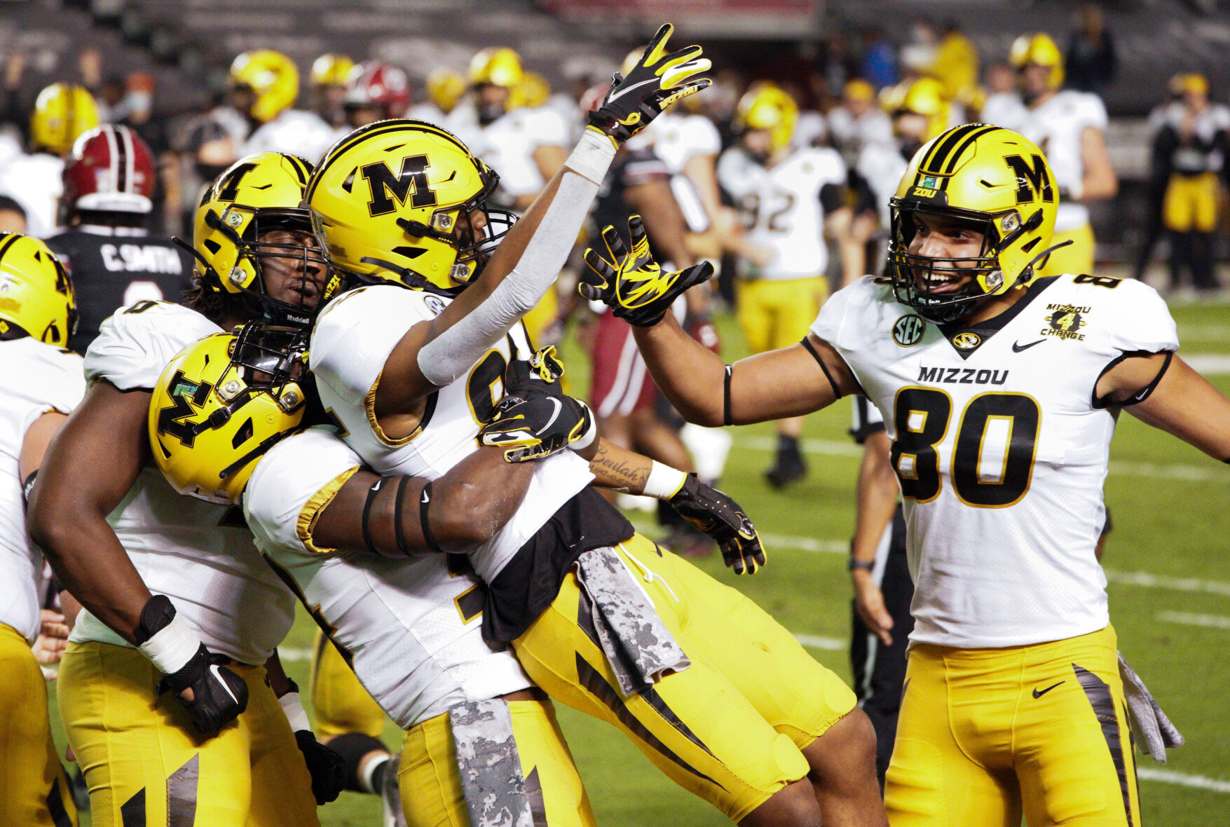 Tauskie Dove and company celebrate his touchdown reception